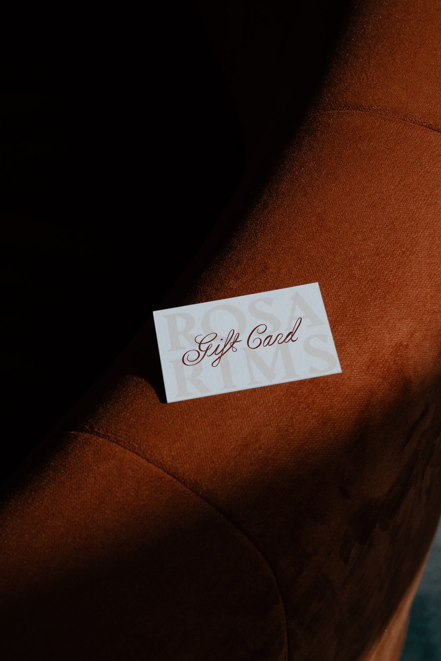 Gift card on a brown surface